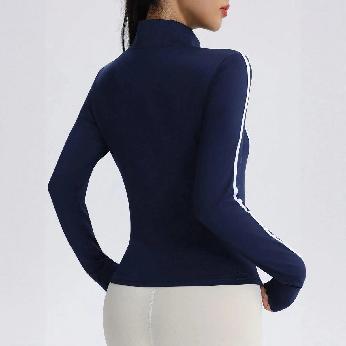 Marina blue women's high-neck sports jacket from Corporación Turística, ideal for fall and winter outdoor activities.