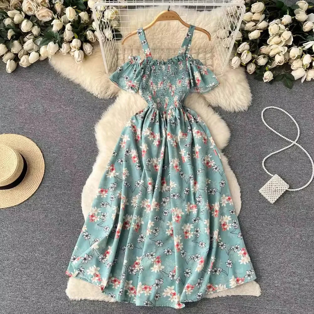Long romantic floral dress by YuooMuoo in navy blue, featuring a flowing silhouette and elegant floral print.