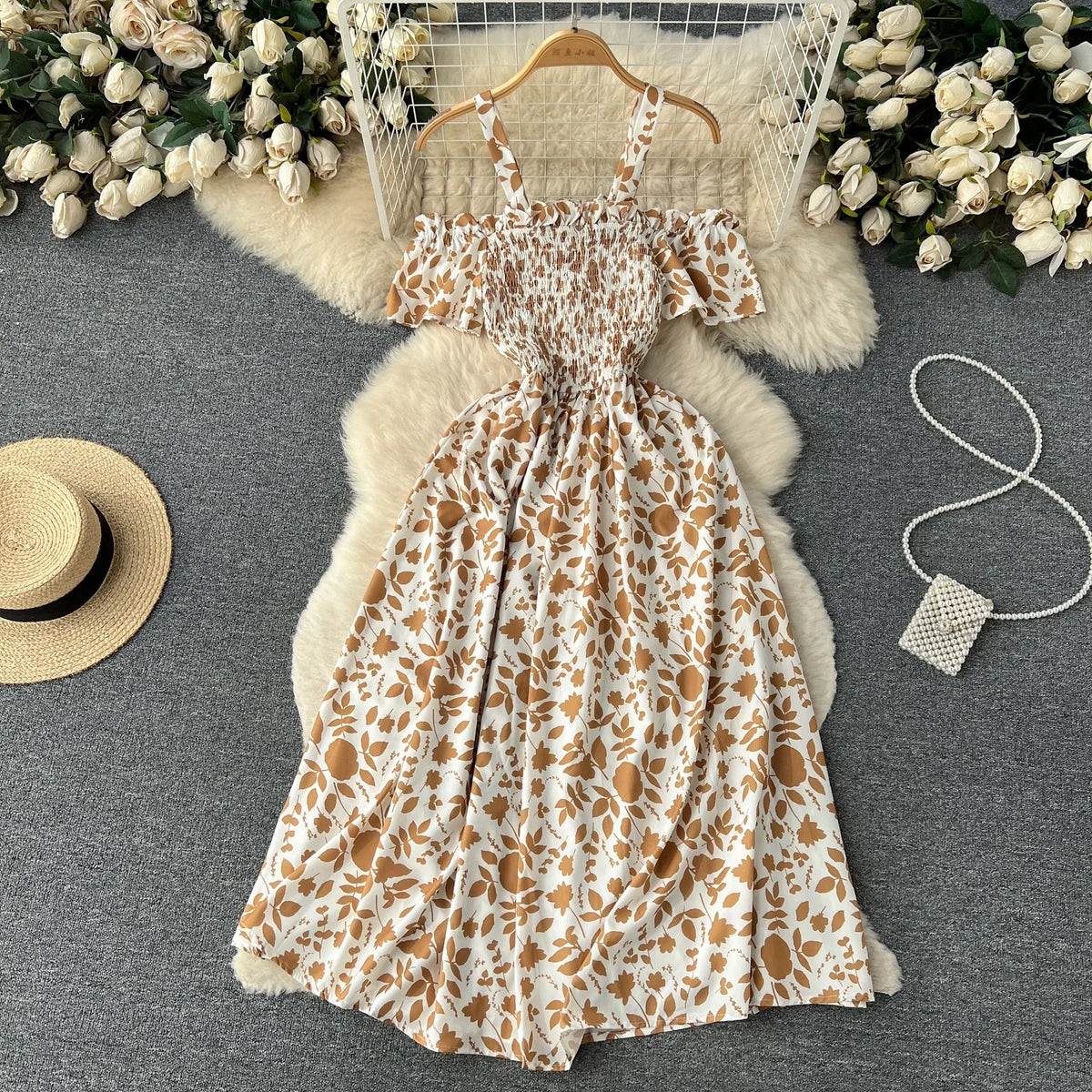 Long romantic floral dress by YuooMuoo in navy blue, featuring a flowing silhouette and elegant print.