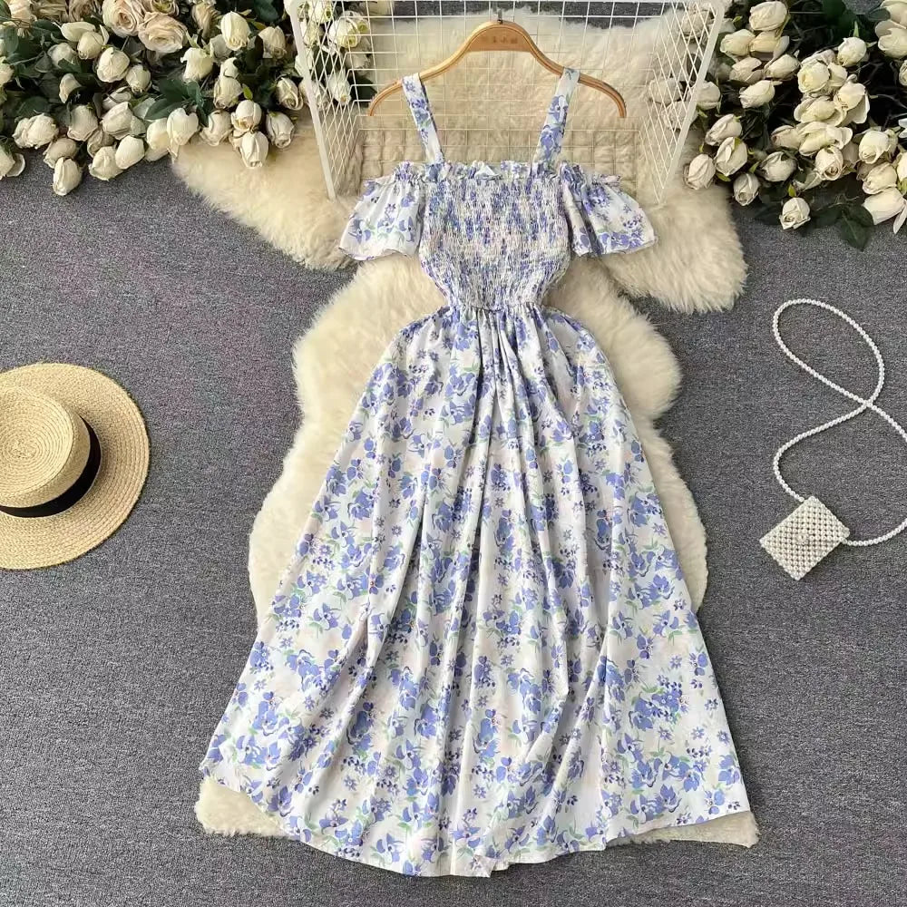 Long romantic floral print dress by YuooMuoo in navy blue, featuring a flowing silhouette and elegant design.