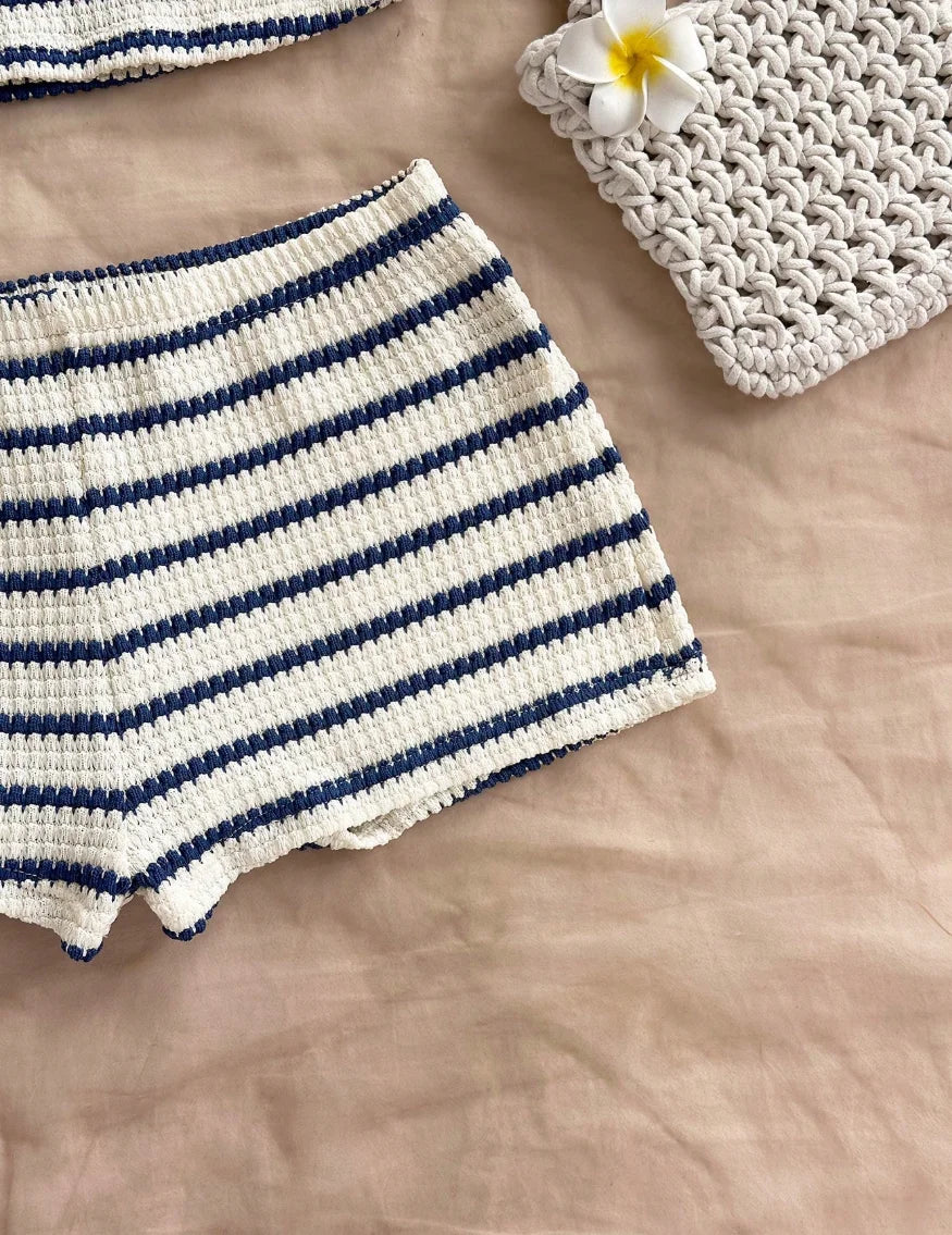 Blue summer two-piece set with halter top and knit fabric, by Corporación Turística, ideal for warm weather wear.