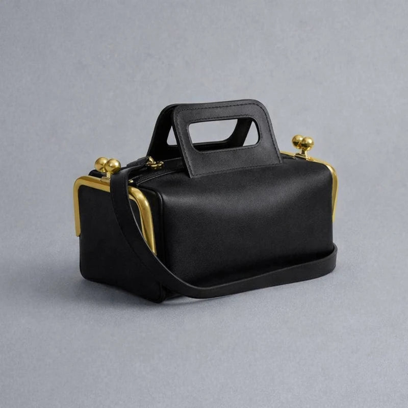Blue PU shoulder bag with a frame closure design, featuring a sleek and stylish look from Corporación Turística.