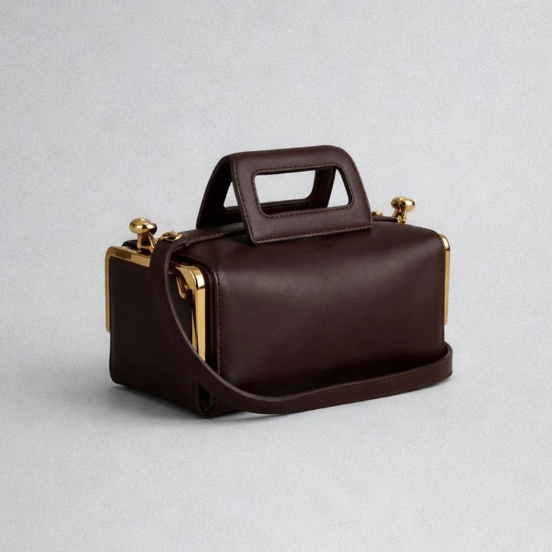 Blue PU shoulder bag by Corporación Turística with a frame closure design, stylish and functional accessory for everyday use.