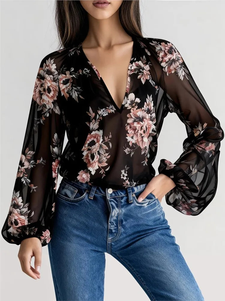 Blue sexy chiffon blouse with deep V-neck and floral print, designed by Corporación Turística, shown on a model.
