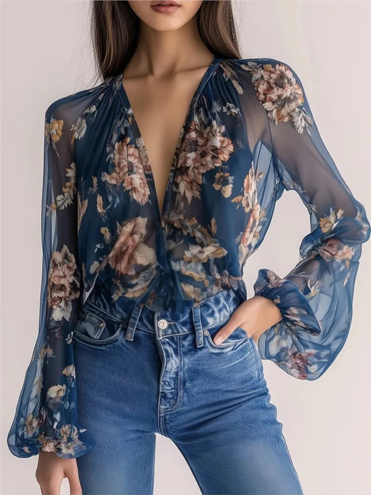 Blue sexy chiffon blouse with deep V-neck and printed pattern, featuring long sleeves and a relaxed fit.