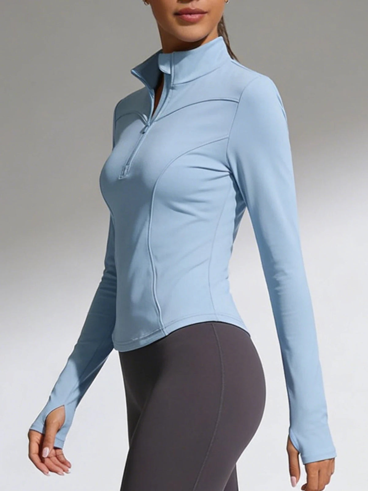 Blue women's fitted yoga sports t-shirt with long sleeves from Corporación Turística, suitable for active wear and yoga practice.