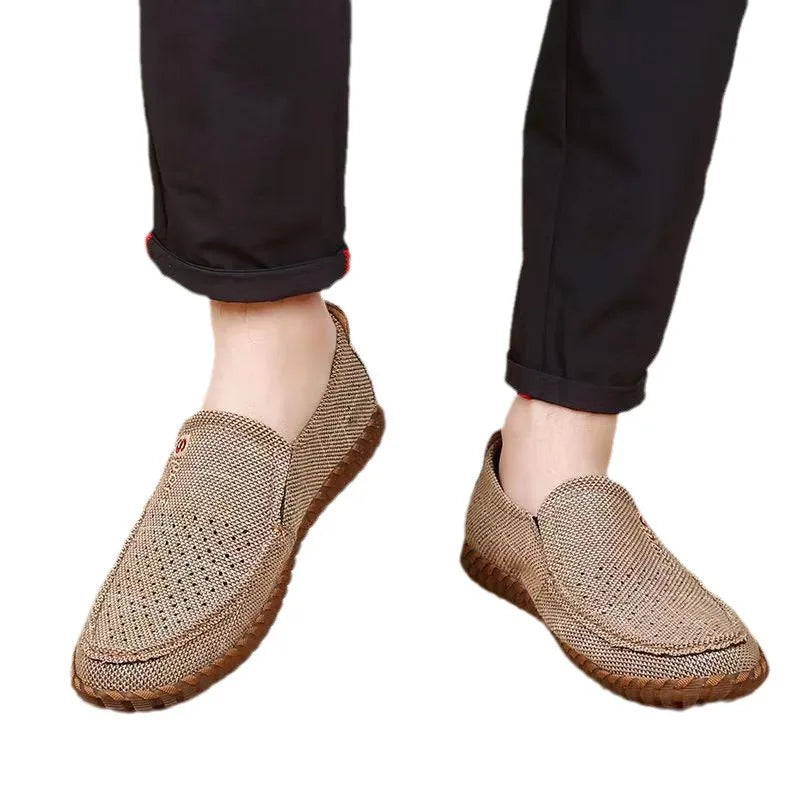 Beige breathable mesh men's sneakers from Corporación Turística, lightweight athletic shoes with comfortable fit.
