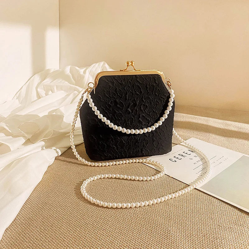 Beige crossbody phone bag with chain strap from Corporación Turística, designed for mobile phone storage and everyday use.