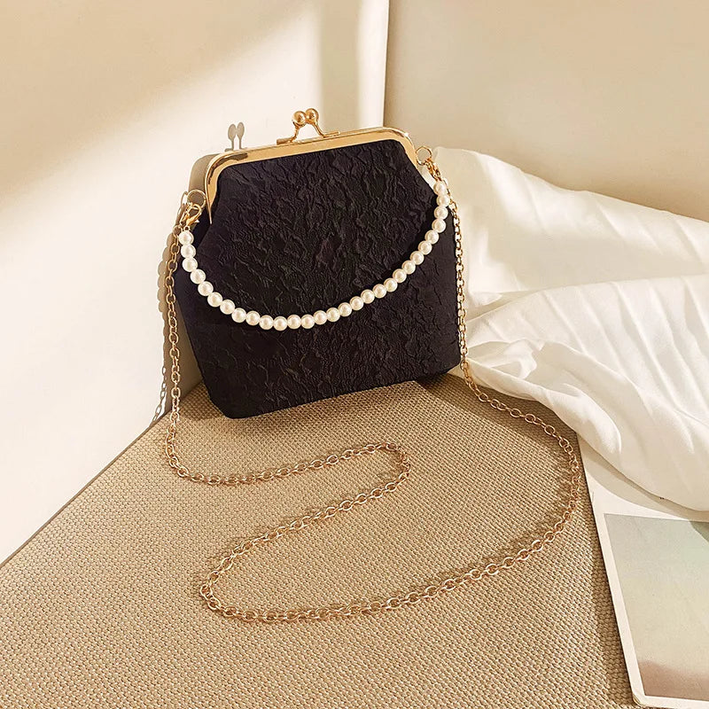 Beige mobile phone crossbody bag with chain strap from Corporación Turística, showing front view with adjustable strap.