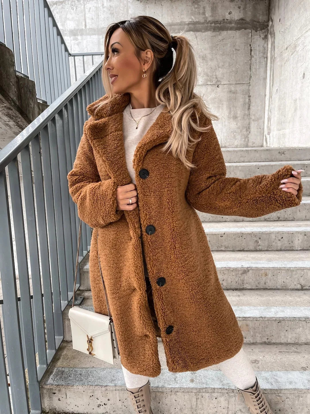 Beige long loose winter coat by Corporación Turística, casual, soft, thick, warm, and plush for cold weather.