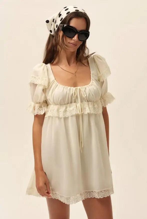 Beige summer dress for women with puffed sleeves, short length, from Corporación Turística, perfect for warm weather.