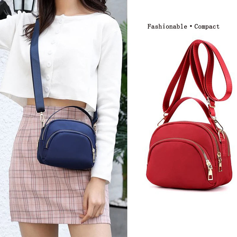 Red versatile modern shoulder bag for men and women by Corporación Turística, with sleek design and adjustable strap.