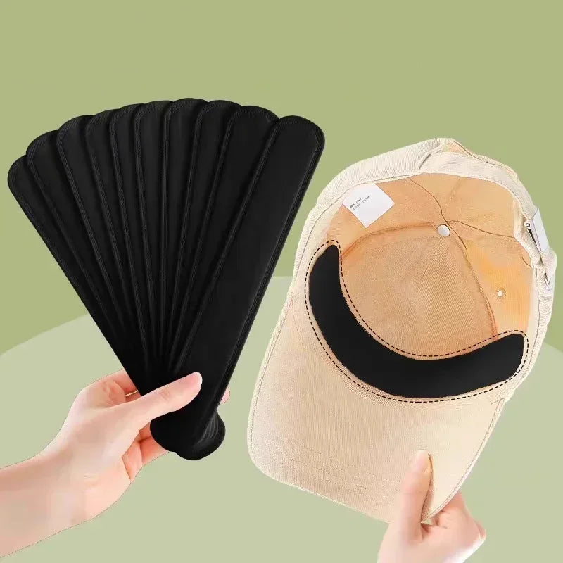 Set of 10-40 absorbent sweat stickers for hats by Corporación Turística, shown on a black hat in the image.