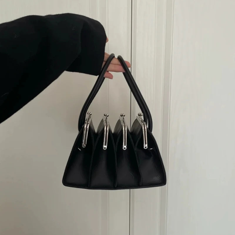 Black multi-layer shell clip clutch bag for women, 22cm by 19cm by 12cm, stylish and elegant handbag from Corporación Turística.