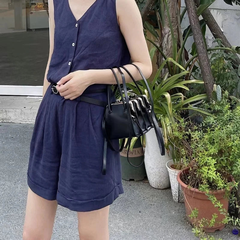 Black multi-layer shell clasp clutch bag for women, featuring a sleek design with a sturdy clip, size 22cm by 19cm by 12cm.