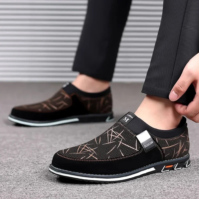 Luxurious black leather men's loafers by Corporación Turística, slip-on moccasins with sleek, polished design.