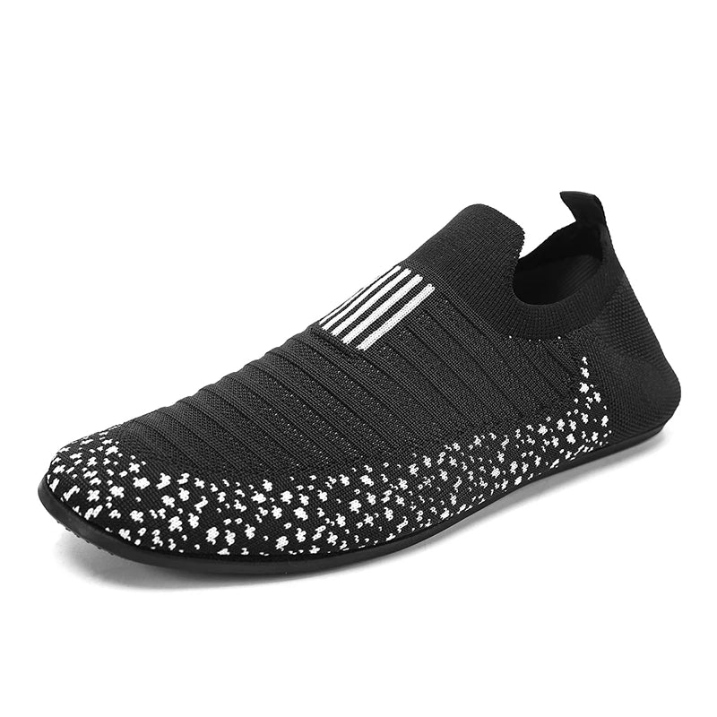 Black YRZL men's driving loafers by Corporación Turística, showing the sleek slip-on design and comfortable leather upper.