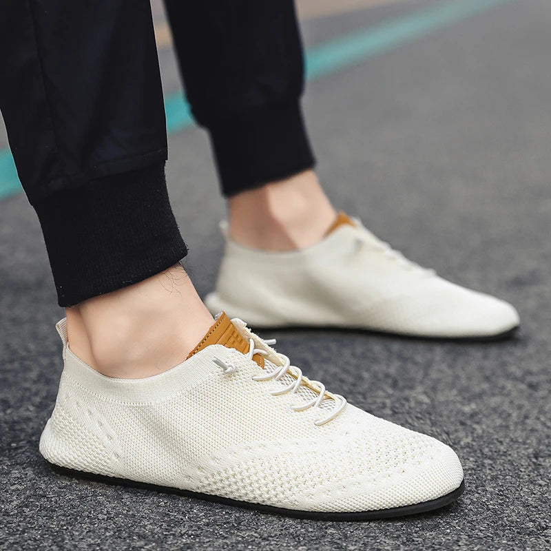 Black MAEDEF men's casual driving shoes from Corporación Turística, featuring a sleek leather design and comfortable slip-on style.