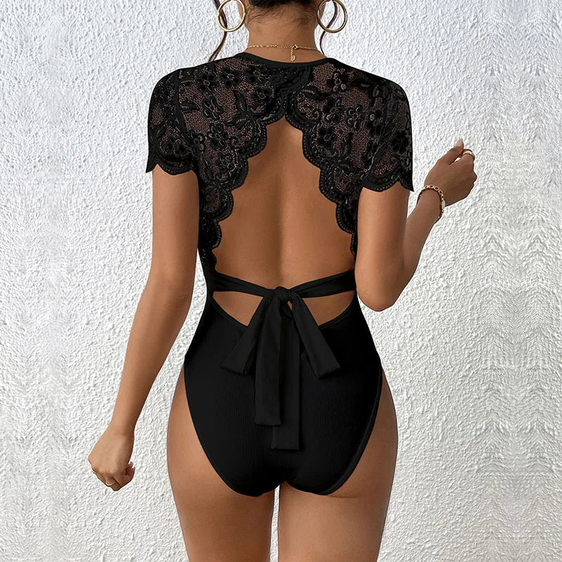 Black lace short-sleeve body suit for women, sexy and fitted, featuring delicate lace fabric and a flattering silhouette.