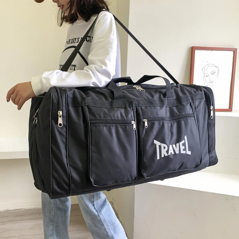 Black foldable travel bag from Corporación Turística, large capacity sports style duffel bag, ideal for trips and gym use.