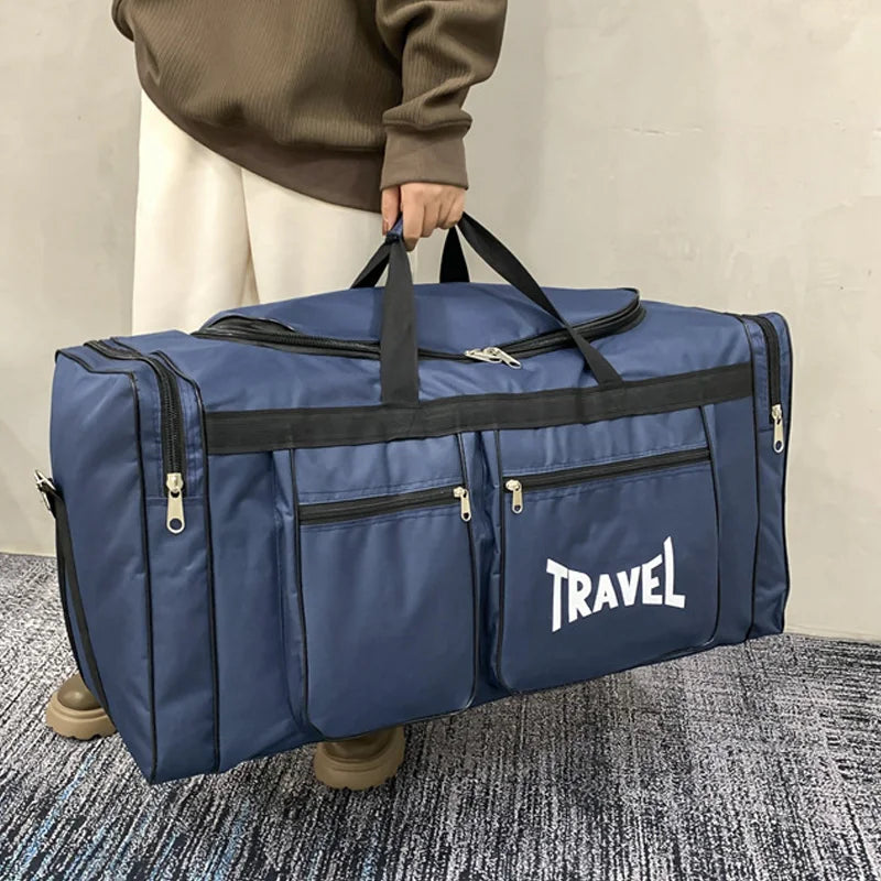 Large capacity foldable travel bag from Corporación Turística, black sports-style duffel bag with adjustable straps.