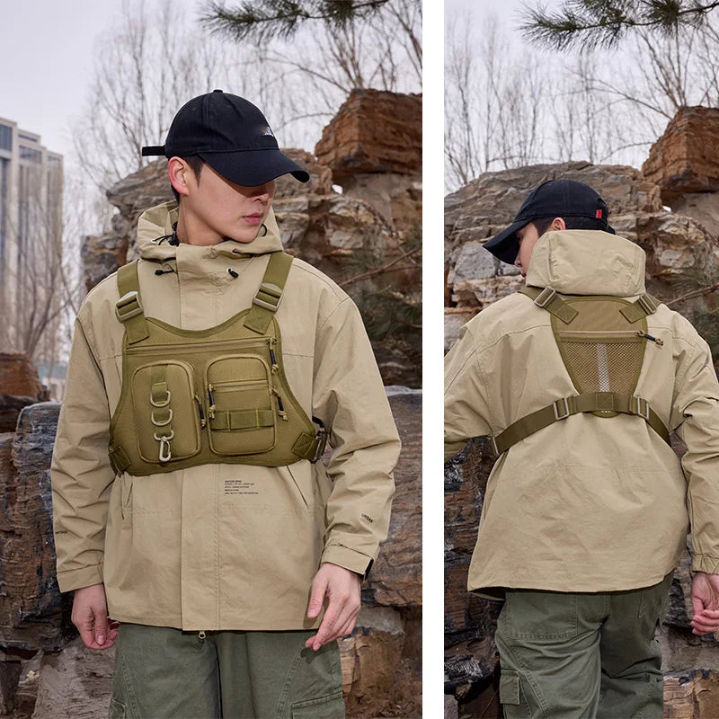 Black camo tactical vest with front Molle system and chest pouch, designed for outdoor and tactical use by Corporación Turística.