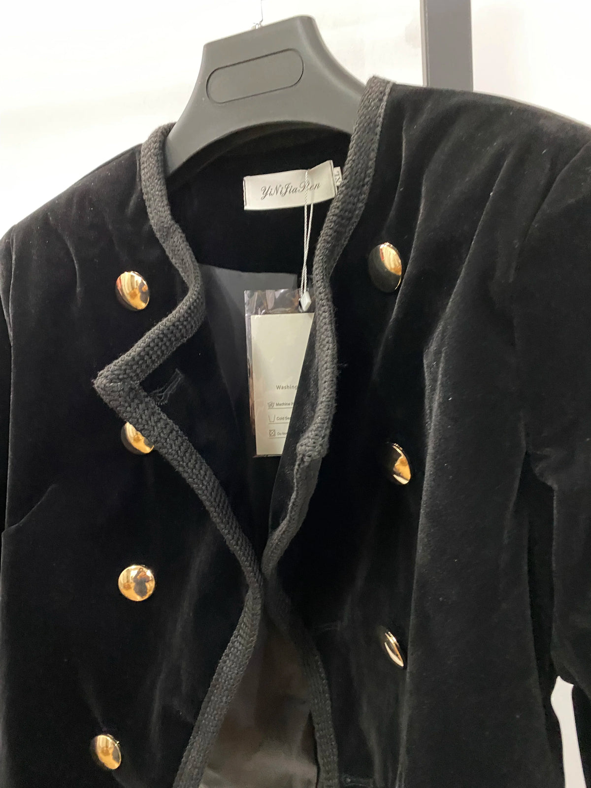 Black women's short jacket from Corporación Turística, stylish fall and winter coat with a modern fit and warm fabric.