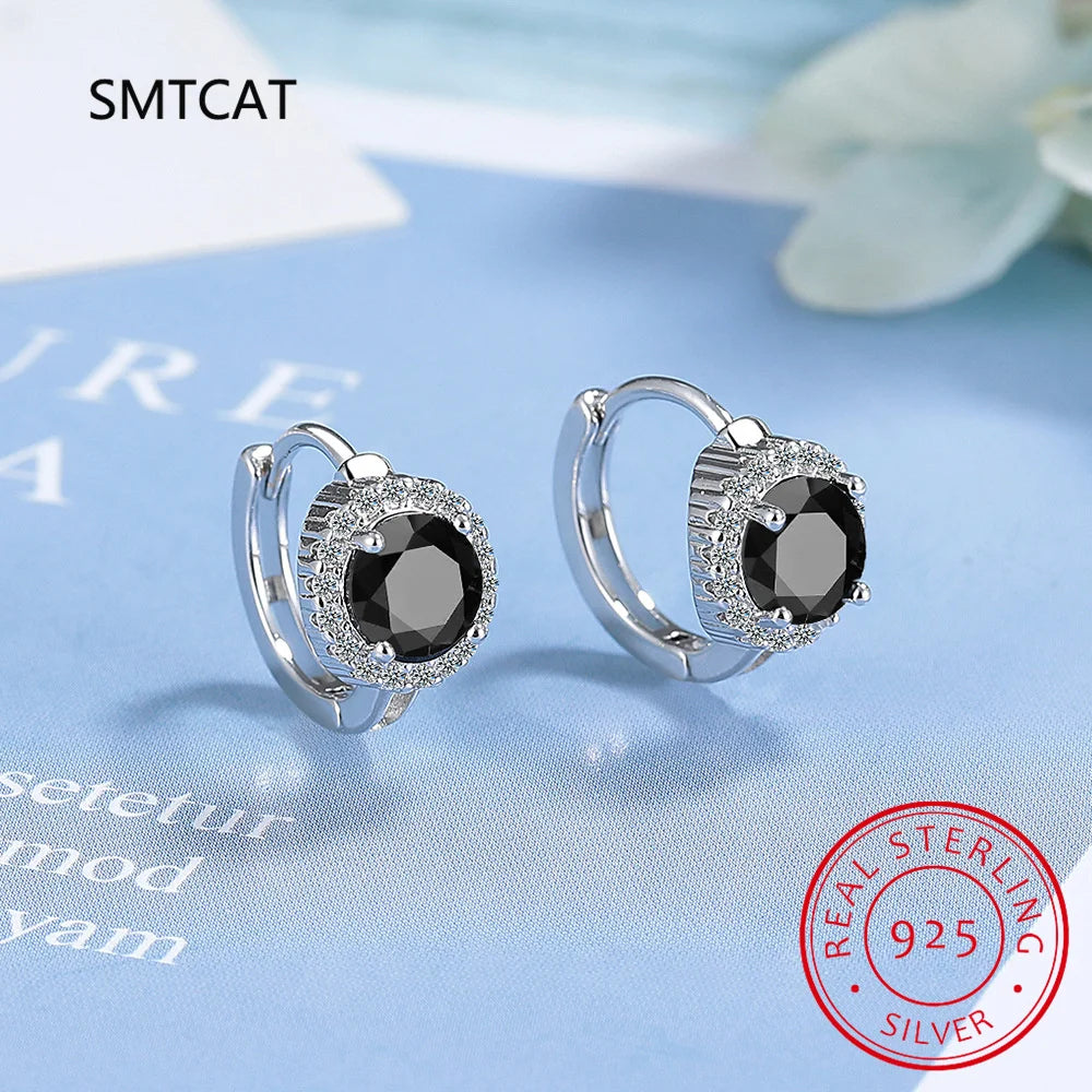 Silver 925 blue sapphire hoop earrings featuring elegant circular design, crafted by Corporación Turística.