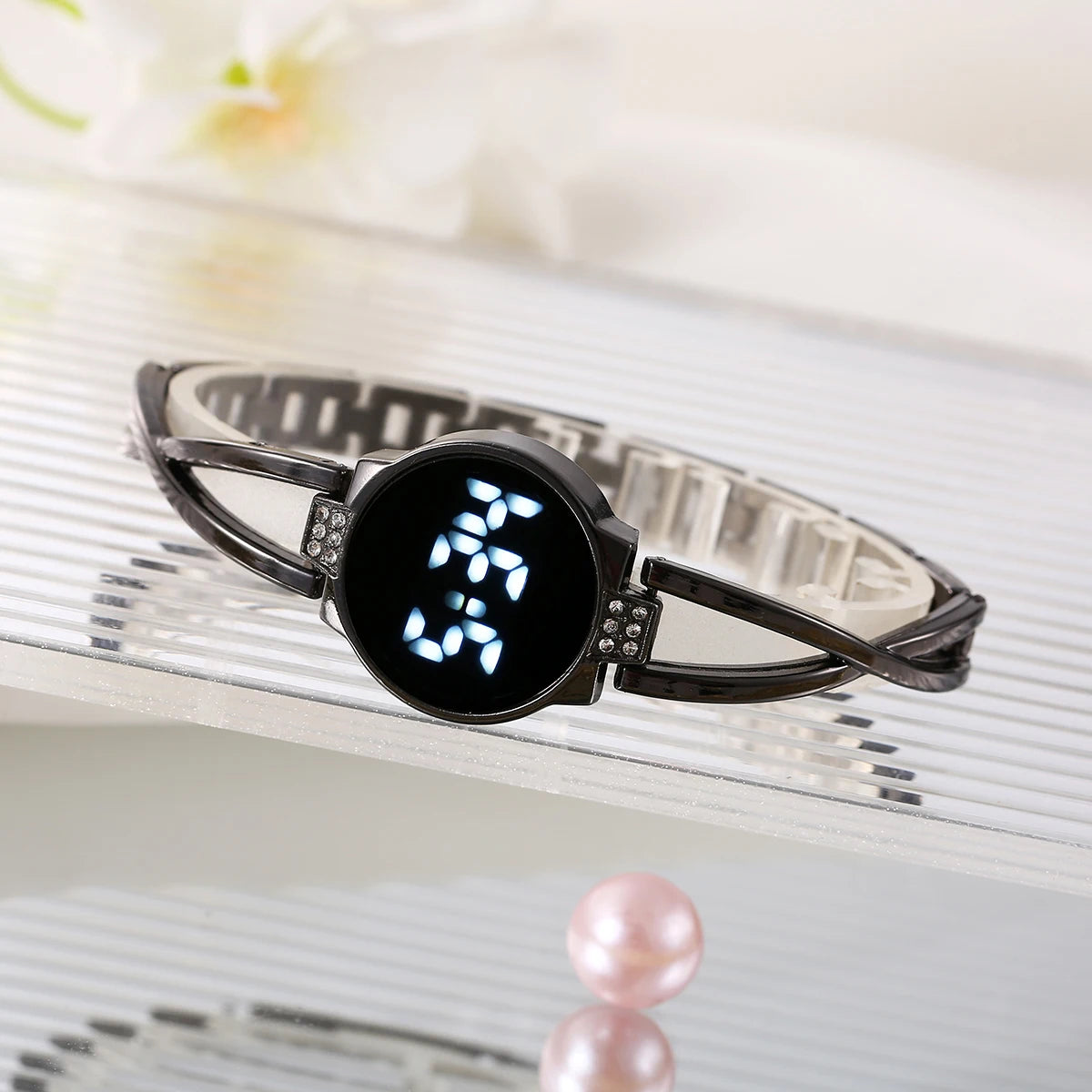 Black fashionable Korean-style LED touch watch for women, featuring a sleek design and modern digital display.
