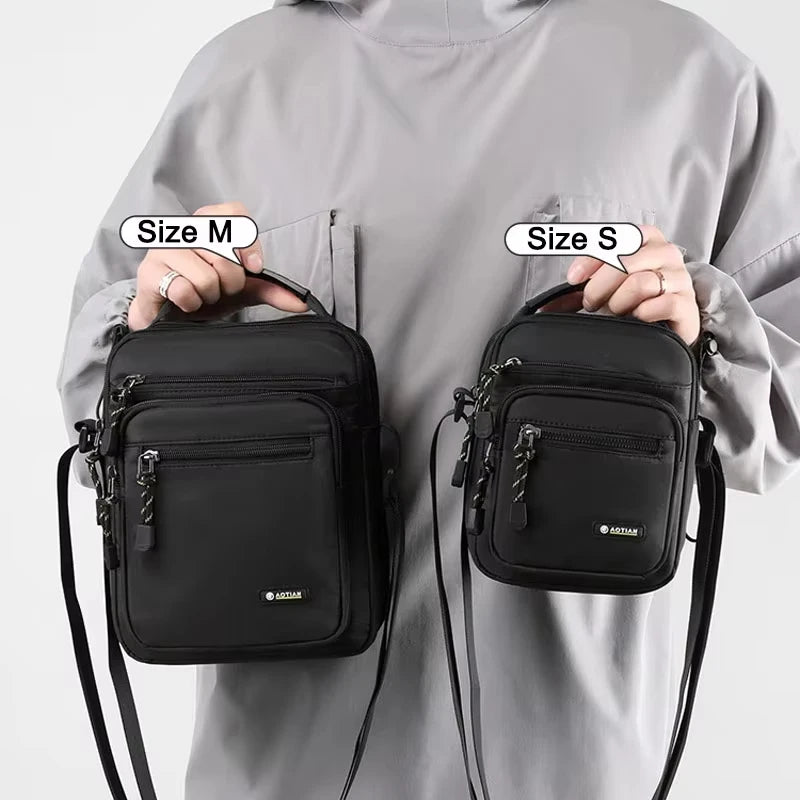 Black men's shoulder bag for camping and hiking by Corporación Turística, with adjustable strap and outdoor-ready design.