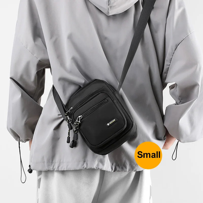 Black men's shoulder bag for camping and hiking by Corporación Turística, featuring multiple compartments and sturdy strap.