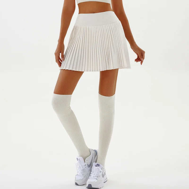 Black sexy yoga shorts with a pleated skirt design, by Corporación Turística, ideal for fitness and activewear.