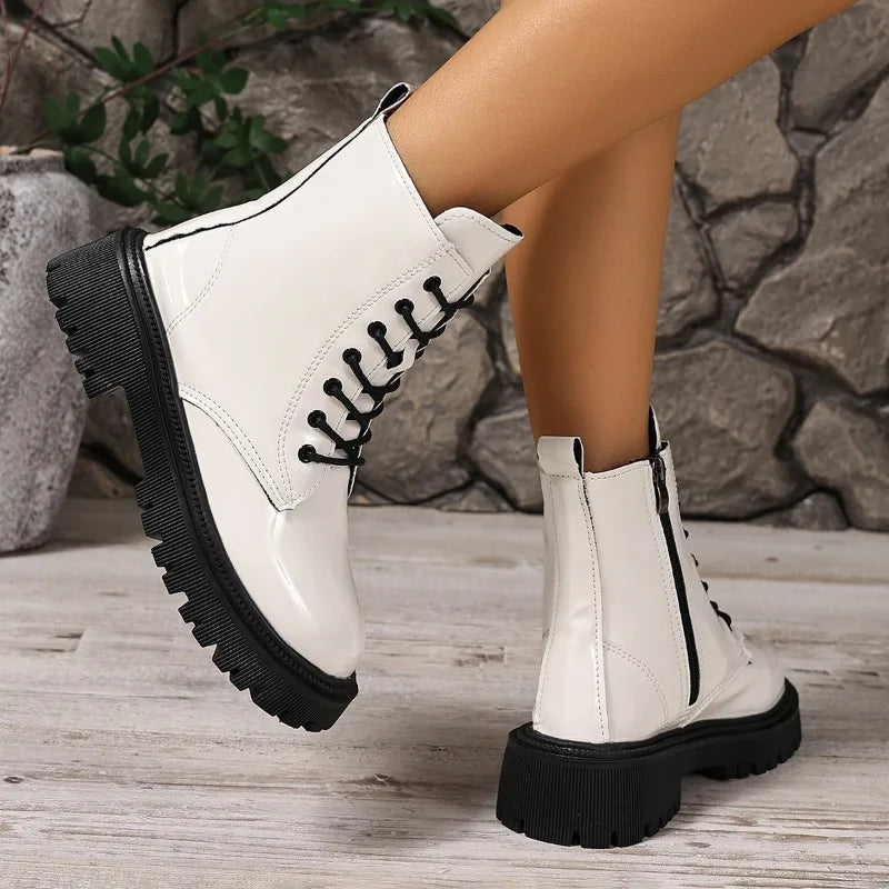 Black women's ankle boots by Corporación Turística, versatile slip-on booties with a sleek design and comfortable fit.