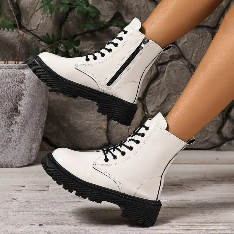 White women's ankle boots by Corporación Turística, versatile slip-on botines with a stylish design and comfortable fit.