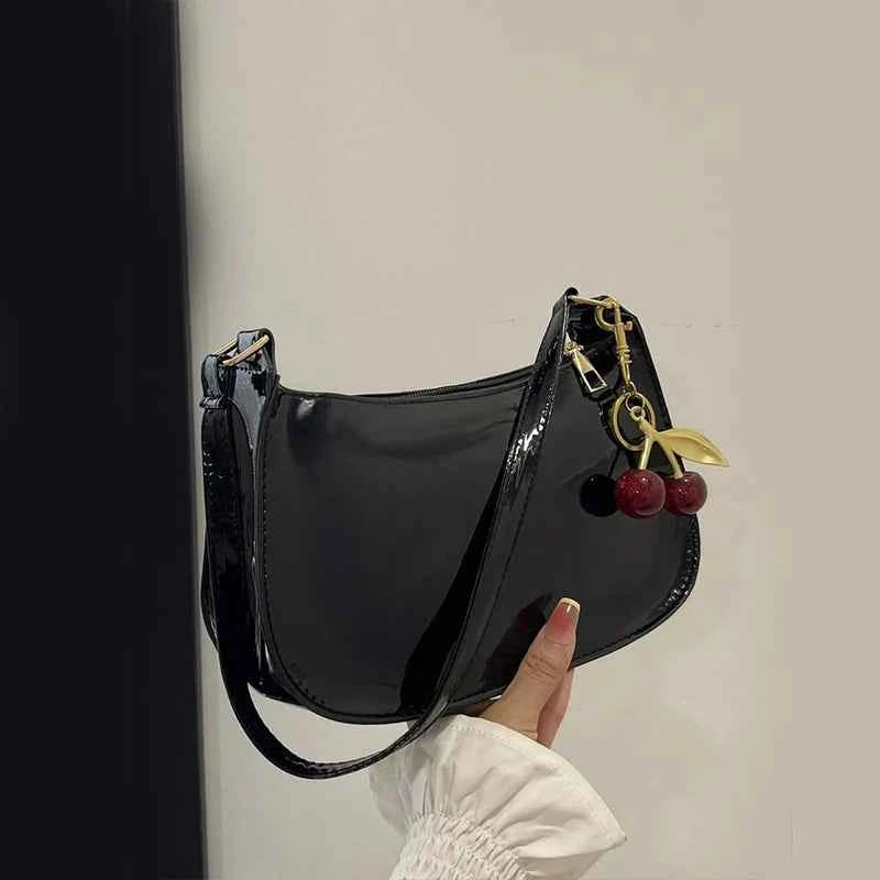 White synthetic leather women's clutch bag with shoulder strap from Corporación Turística, stylish and versatile for everyday use.