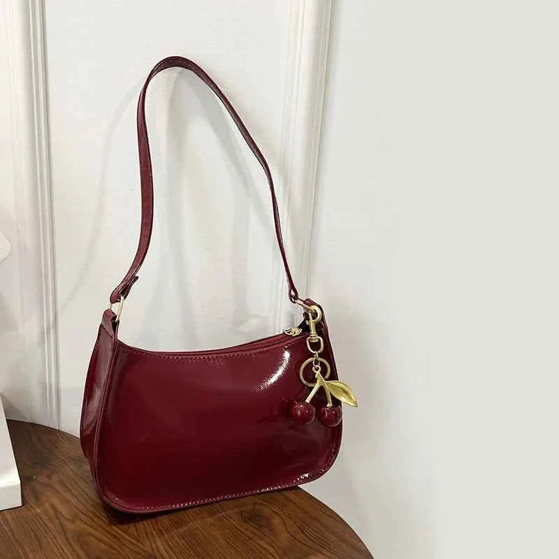 Synthetic leather women's handbag by Corporación Turística, white shoulder bag with sleek design and top handle, stylish for everyday use.