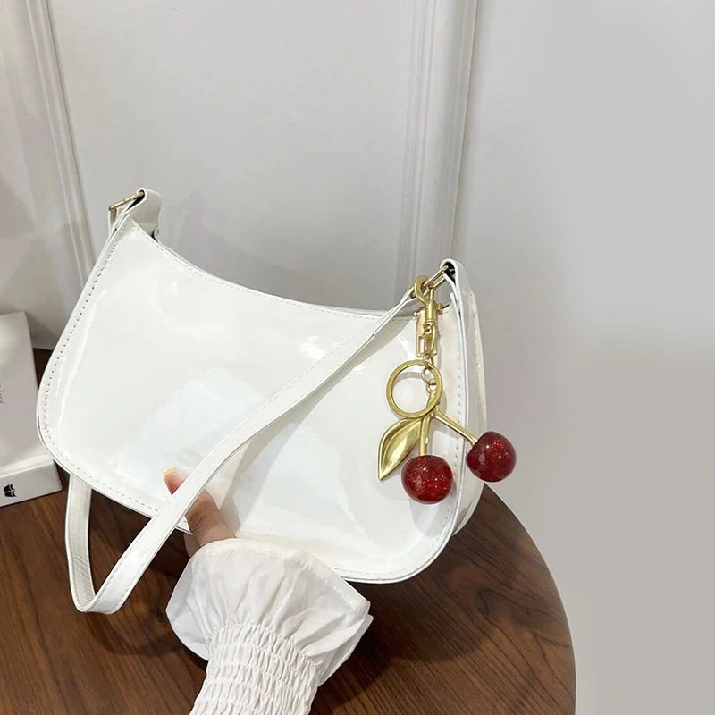 Synthetic leather women's shoulder handbag featuring a sleek white design, ideal for stylish and practical everyday use.