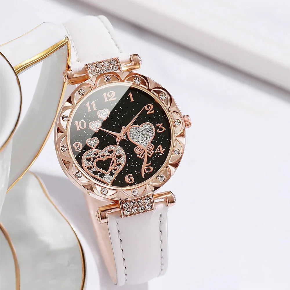 Set of four white quartz watches with diamond accents by Corporación Turística, featuring elegant round faces and silver straps.