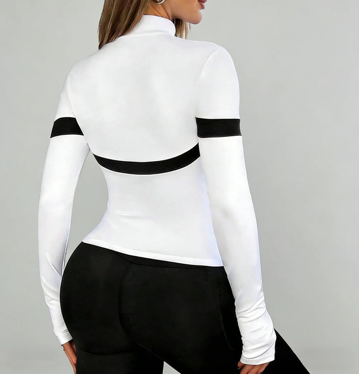 White long-sleeve sports shirt with high collar from Corporación Turística, designed for active wear and comfort.