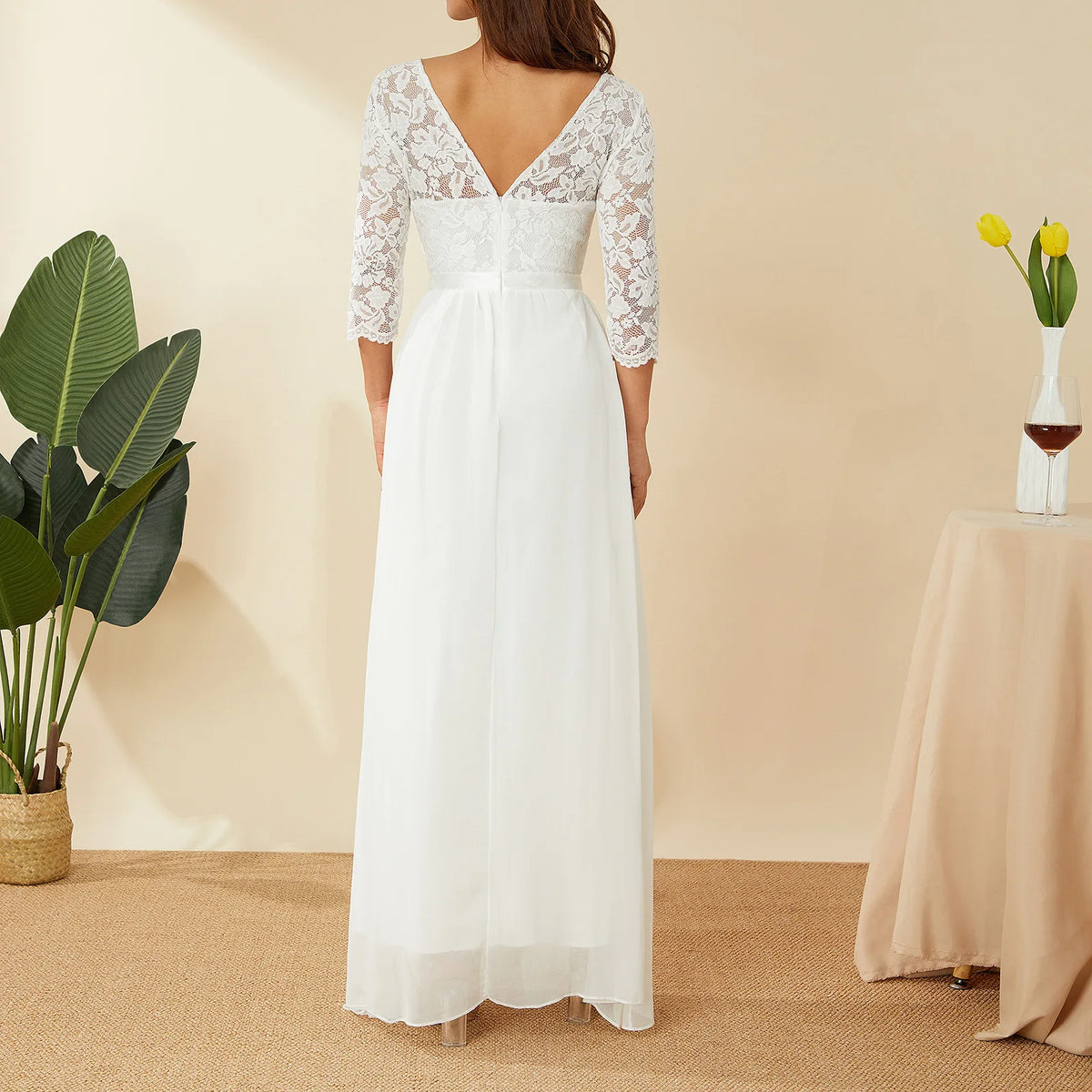 Elegant white long lace chiffon dress by Corporación Turística, flowing and sophisticated for formal occasions.