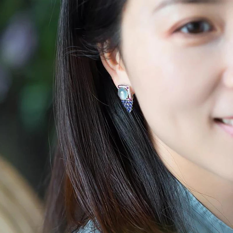 Red calcedonia earrings with round, egg-shaped ice-blue stones, showcasing natural gemstone jewelry style.
