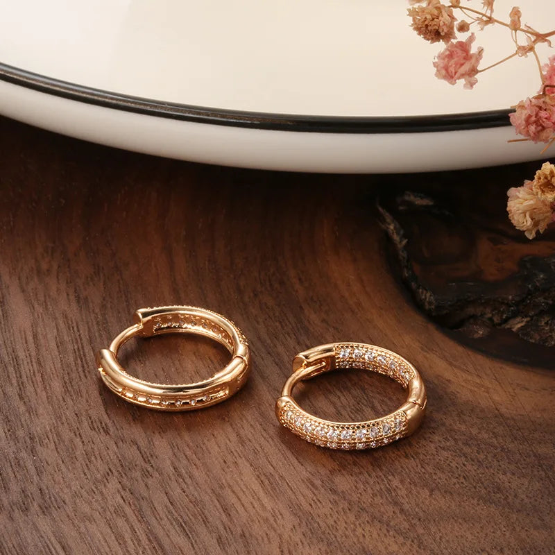 14k gold and diamond earrings for women, elegant real gold jewelry by Corporación Turística, showcasing sparkling gemstone details.