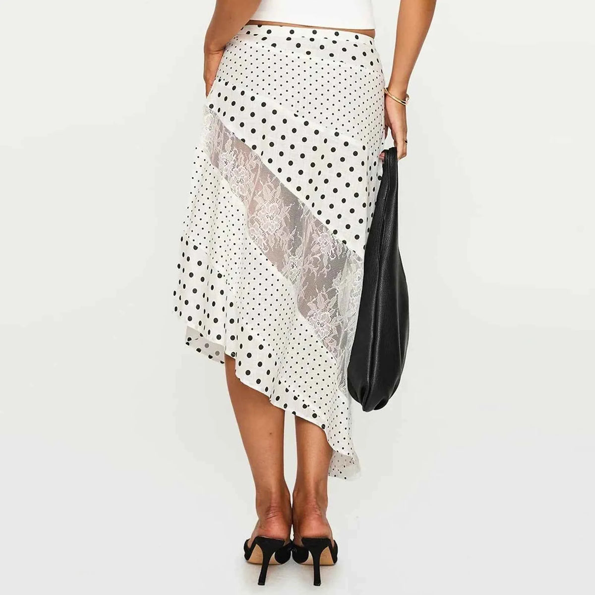 White women's midi flowing lace skirt with an irregular hem, stylish and elegant, perfect for casual or dressy occasions.