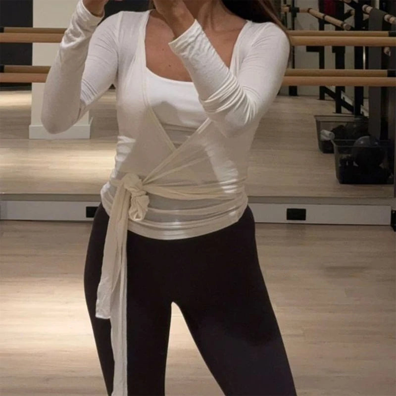 White women's yoga crop top with crossed tie detail from Corporación Turística, perfect for activewear and comfortable fit.