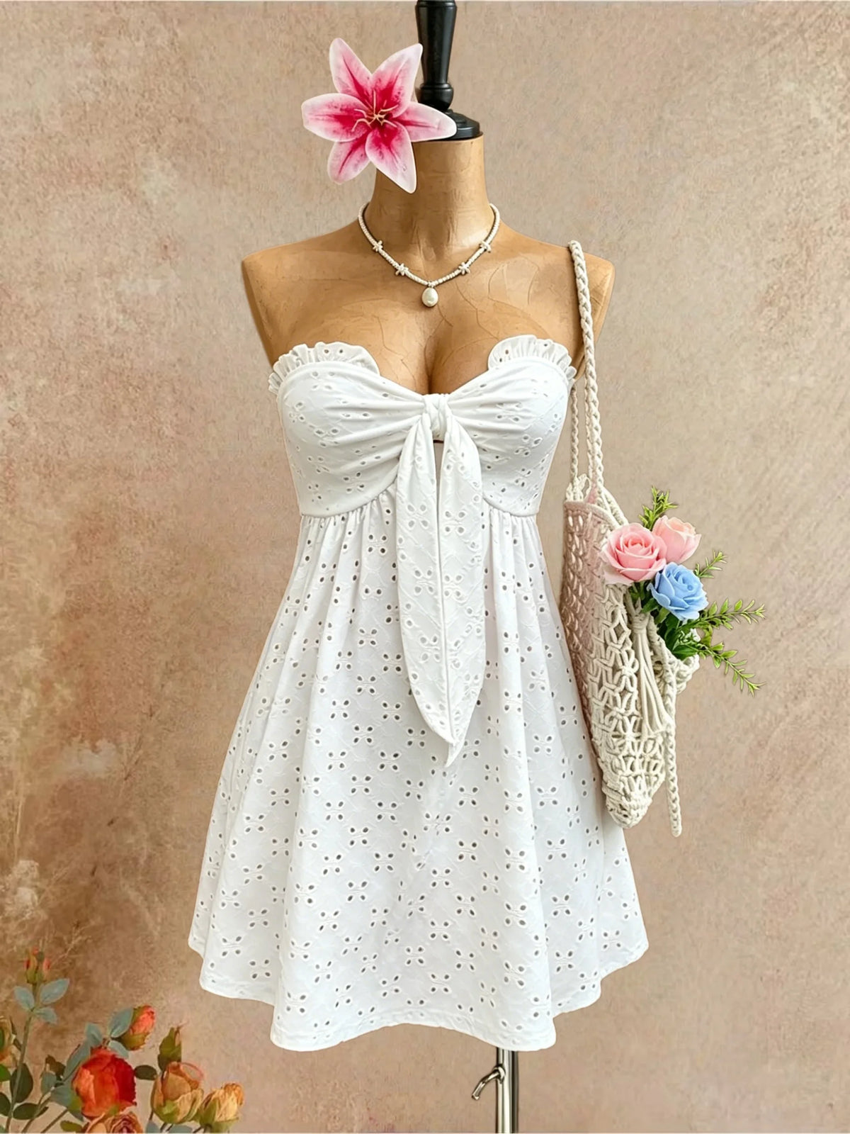 White summer sleeveless short dress for women with ruffle details, designed by Corporación Turística.