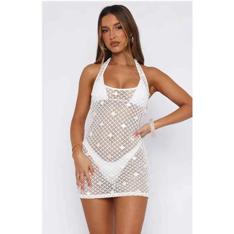 White women's crochet beach dress with a gathered, flowy design, perfect for summer by Corporación Turística.