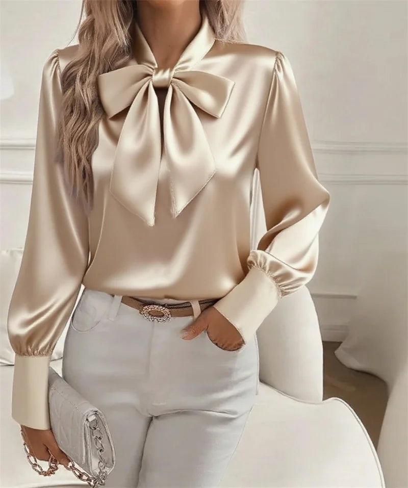 Elegant white satin blouse for women by Corporación Turística, stylish and fashionable, shown in a close-up image.