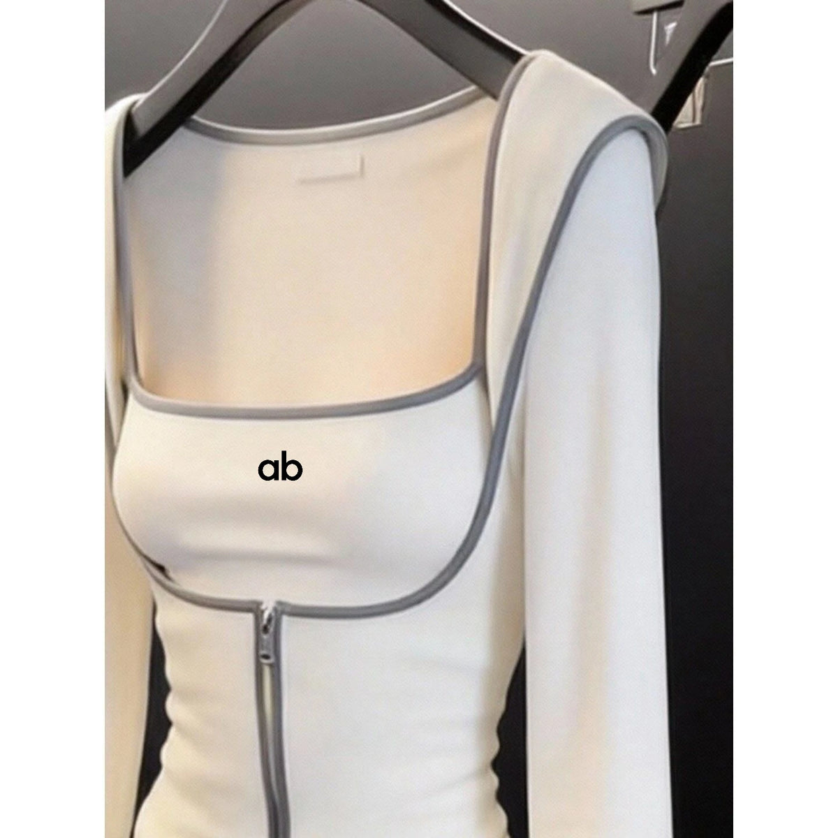 White 2-piece yoga set for women with cardigan and leggings from Corporación Turística, shown in XL size.