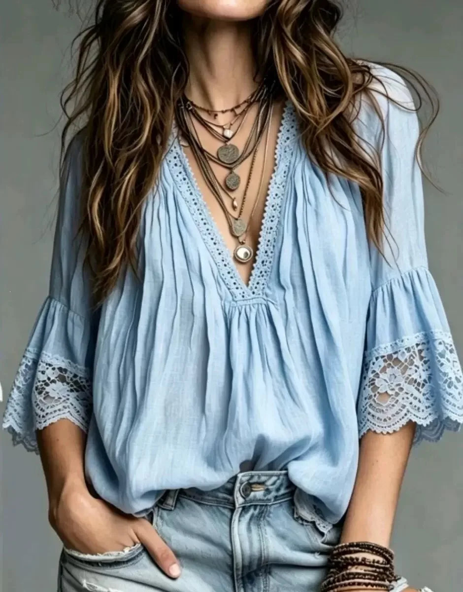 White bohemian blouse with V-neck for women, featuring a relaxed European style, from Corporación Turística.