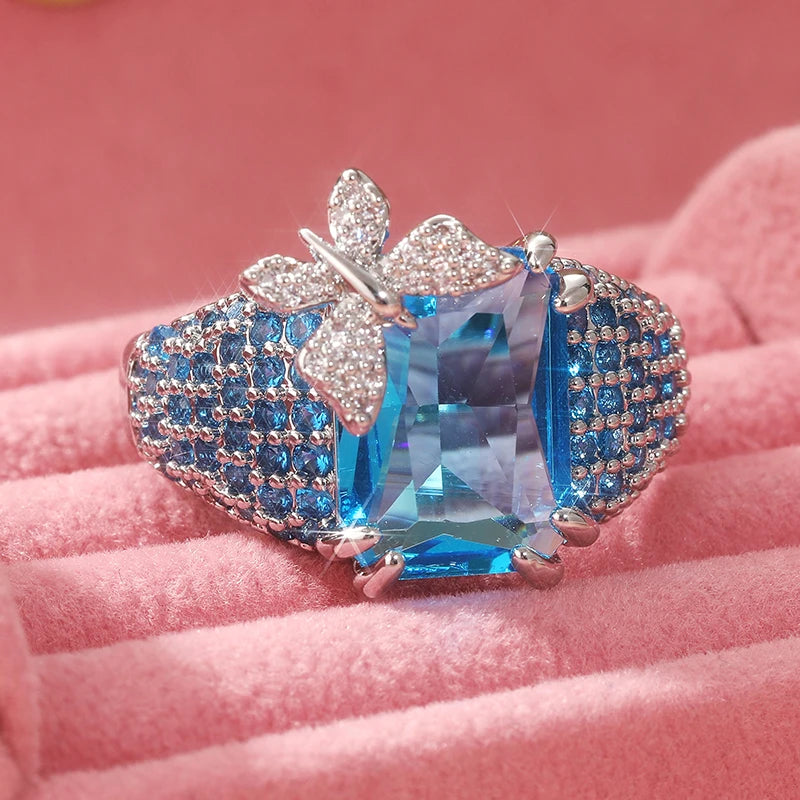 Luxury Butterfly blue topaz cocktail ring featuring a vibrant blue topaz gemstone set in an elegant design.